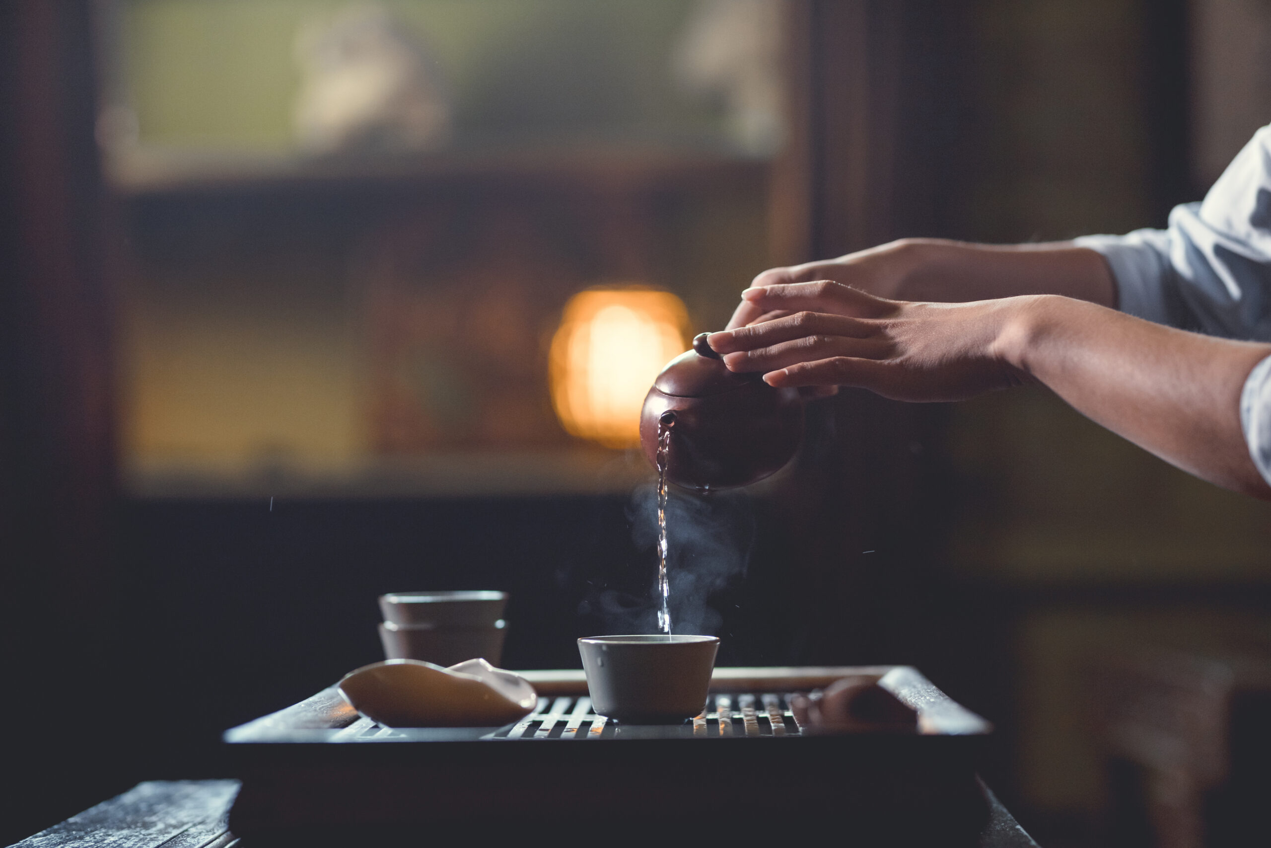 simple everyday scene of preparing tea, showing Zen mindfulness in daily actions