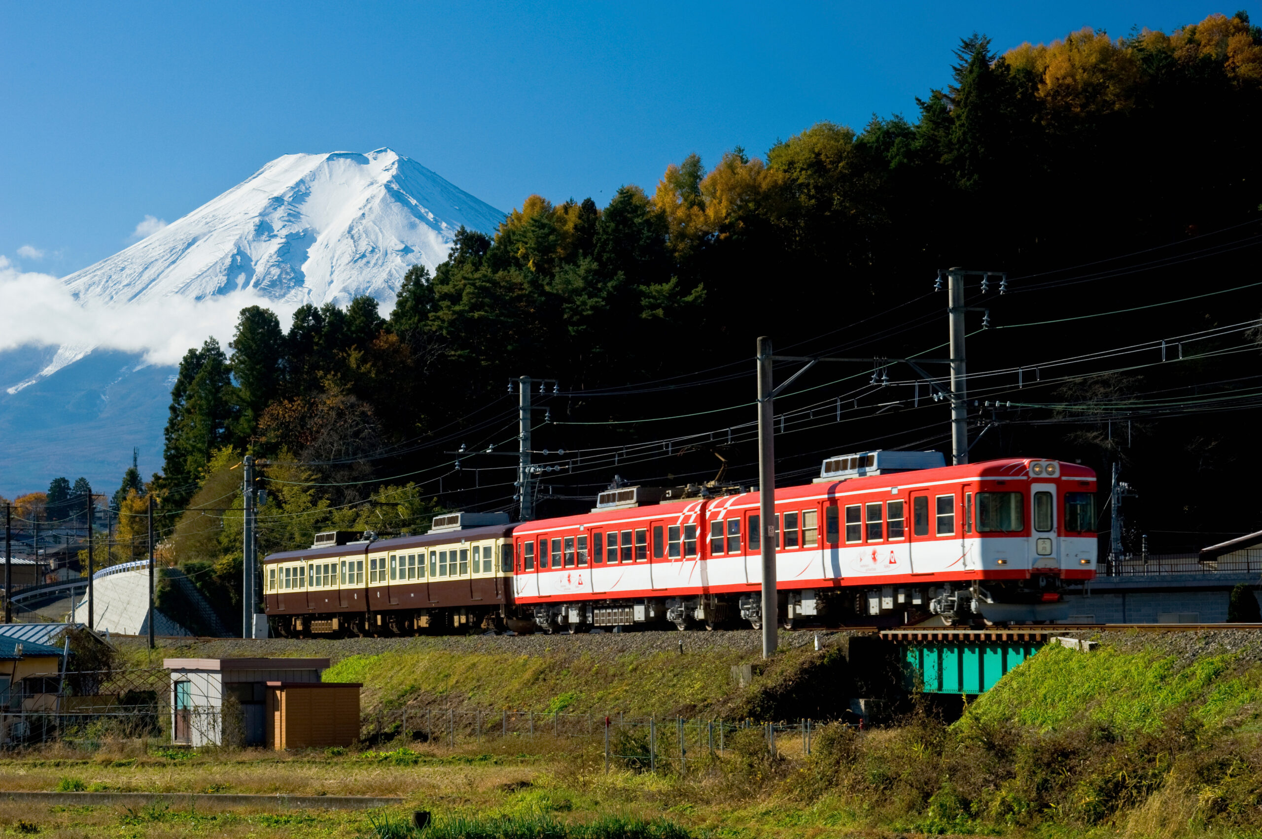 Fujikyu Line train with Mt. Fuji in the background for retreat access