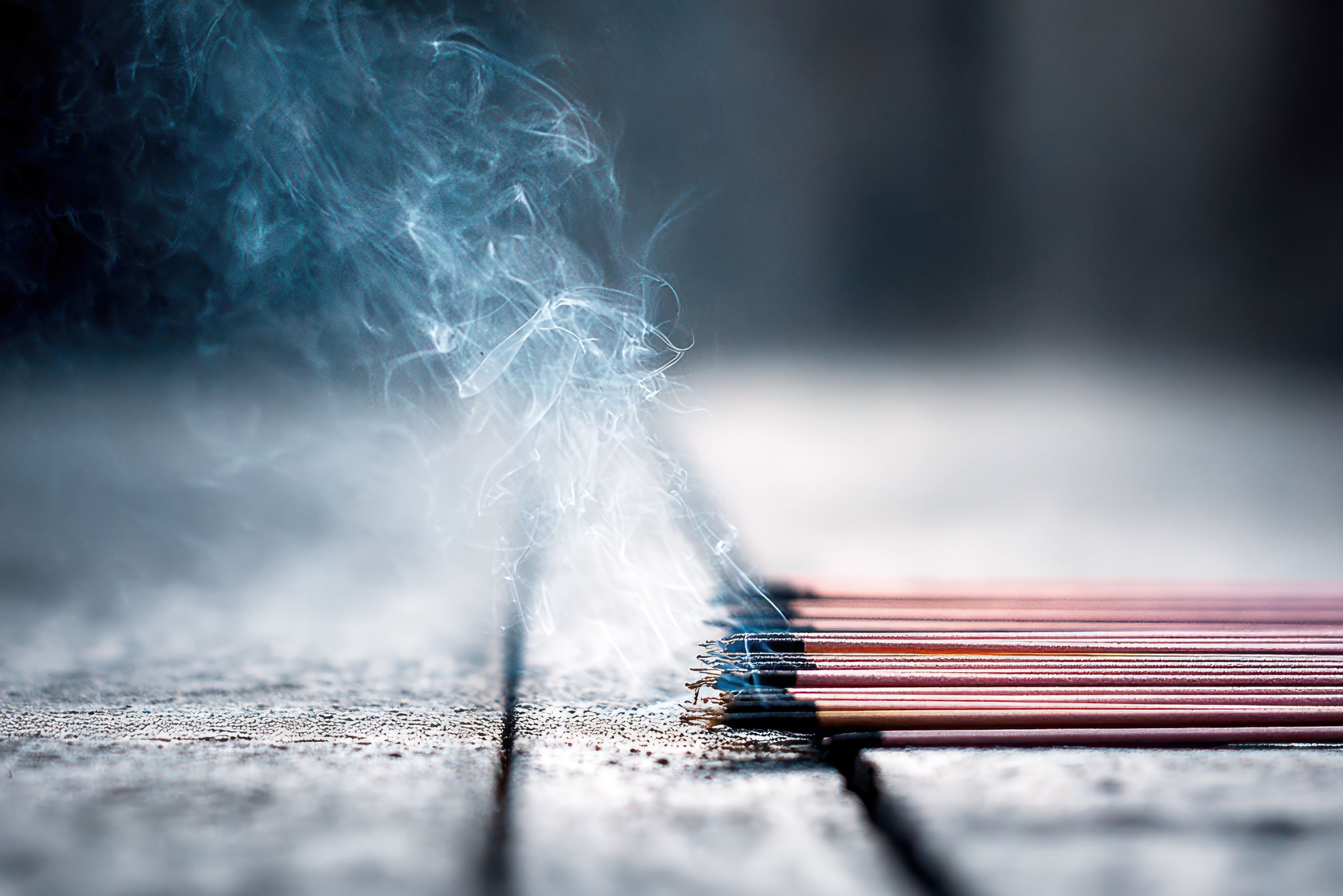 Gentle incense smoke rising in still air, symbolizing mindful breath and awareness in Zen practice